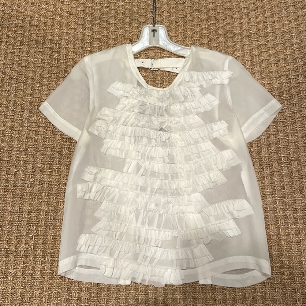 Silk top. Open in back. Great condition. Fun to wear with jeans.